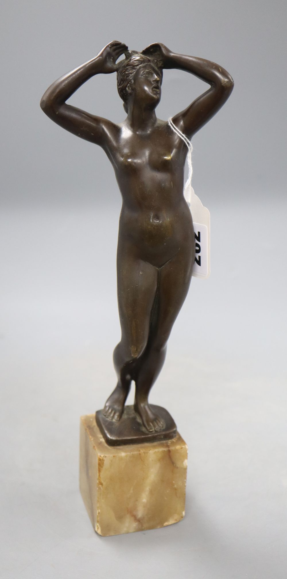 After the antique. A bronze figure of Aphrodite, signed Cartinet, overall height 30.5cm